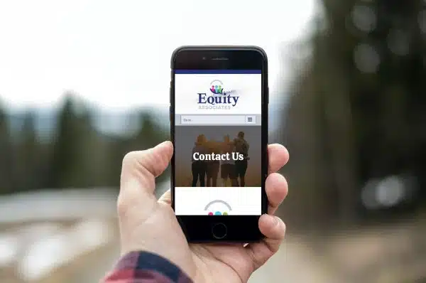 Phone with the Equity Associates website pulled up