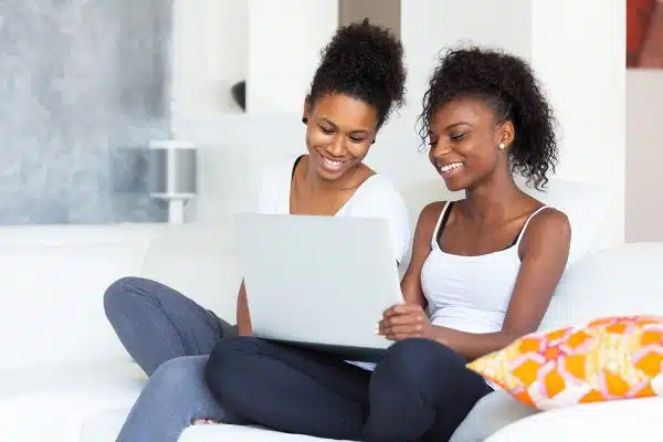 Mom and teenage daughter on a video chat with therapist