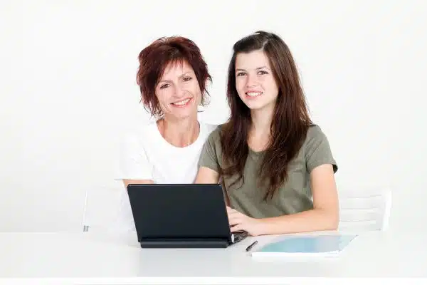 mom and daughter filling out get started with therapy form