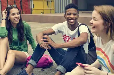 Teenage friends laughing together