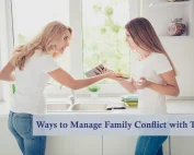 A mom and teen daughter having a family conflict in the kitchen with daughter holding her cell phone.